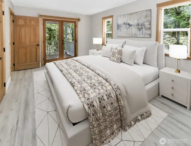 Virtually staged. Primary bedroom with french doors out to deck.
