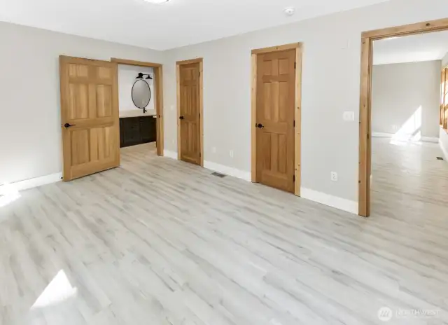 Primary bedroom with two doors to walk in closet.