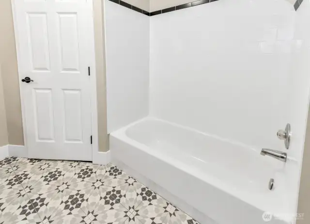 Upstairs full bathroom tub and shower.