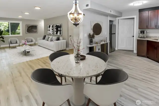 Virtually staged. Basement/MIL Suite dining room, full kitchen, and living area.