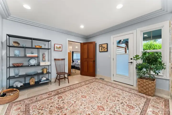 Utility/ Flex Room. Washer and Dryer on the left, door leads to North facing patio w/ access to raised garden beds.