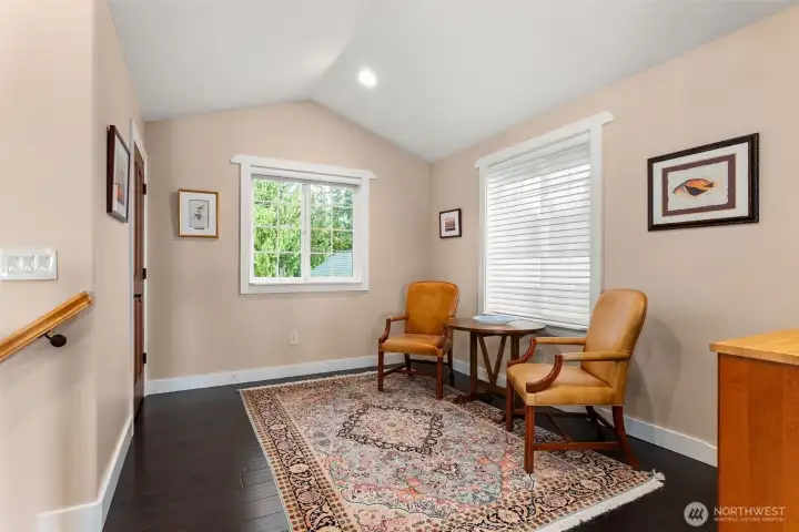 North Tower landing w/ seating, walk-in closet to the left. Wet bar or coffee station on the right.