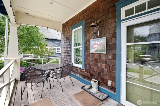 A welcomng porch is ready for your sandy boots and buckets!  A great option for outdoor living on the front of the home.