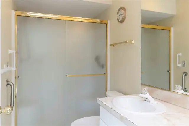 Main Level Primary Bathroom with Walk in Shower
