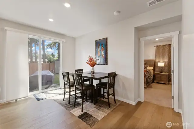 A spacious dining area leads to the back yard.