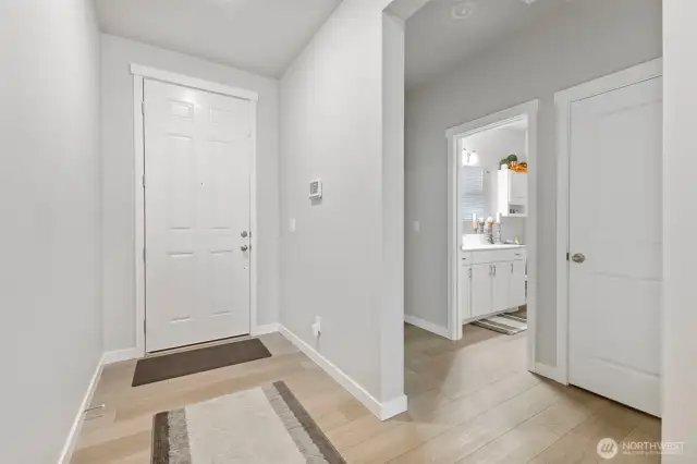 Back toward the entryway are the 2nd & 3rd bedrooms and a full bath.