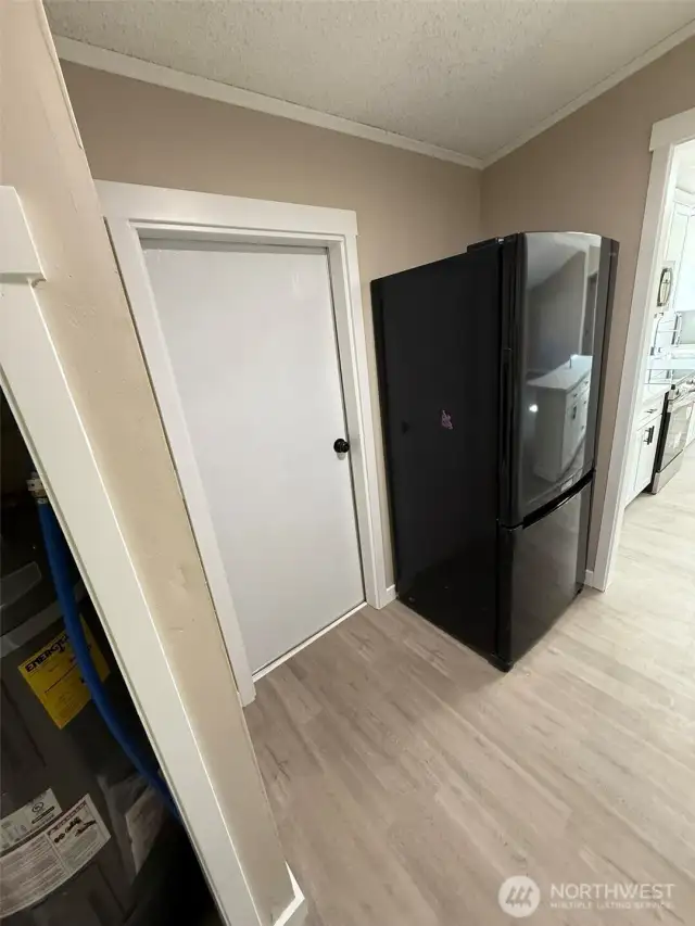 Extra refrigerator in laundry room