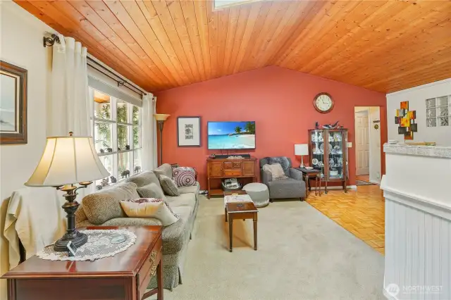 Living room with vaulted pine ceilings