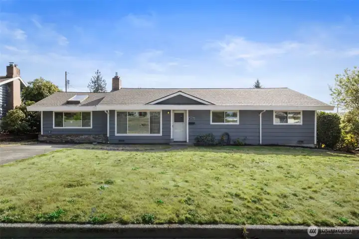 Spacious rambler with 3 bdrms, 1.75 baths, 2 large living areas and generous yard in front and back.