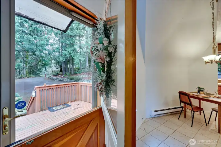 Front door on main floor opens to kitchen, stairs down and living room