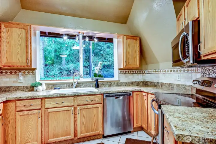 Kitchen with dishwasher, microwave and stove