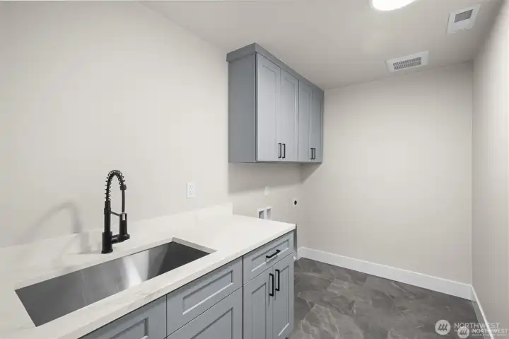 Laundry Room Conveniently Located Just off the Garage Entrance