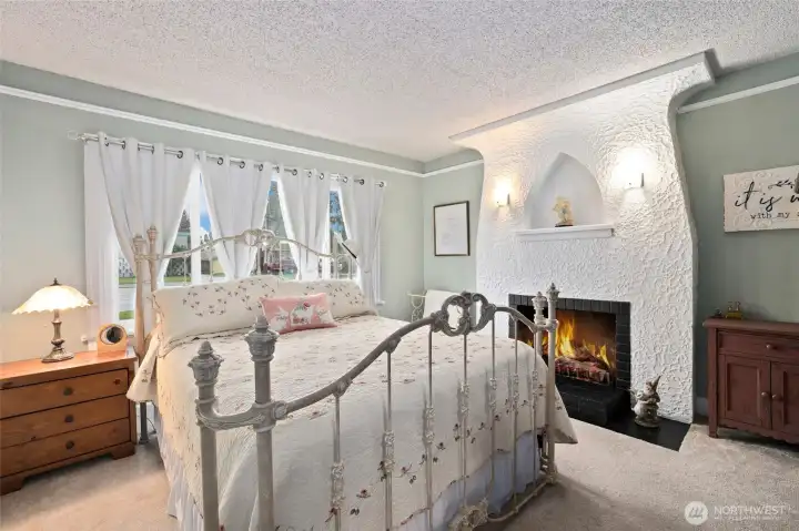 Primary bedroom with beautiful fireplace