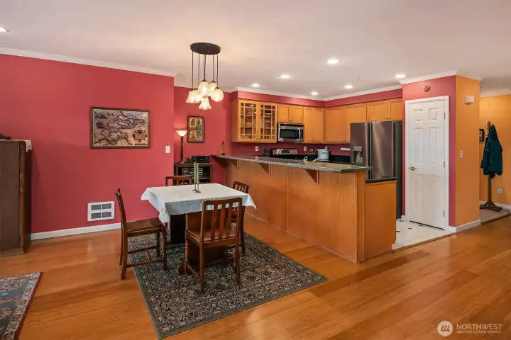 Dining room and kitchen with granite eating bar