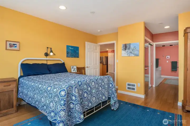 Primary bedroom and entry to the primary bathroom