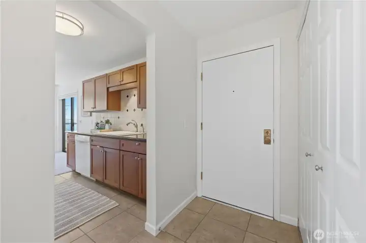 Lovely tile entry to this gorgeous home with coat closet.