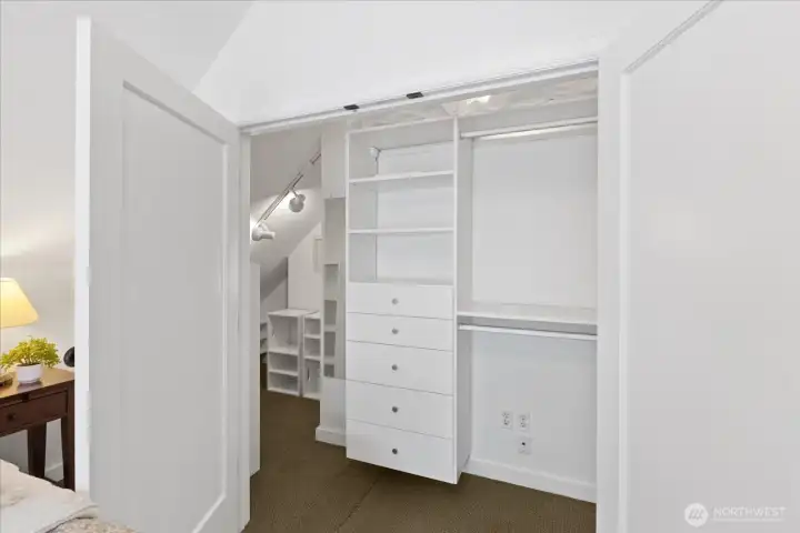 Primary closet with additional space on the side