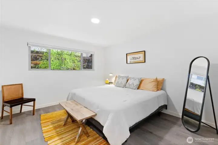Large primary suite overlooking the gardens on the backside of the building Large primary suite overlooking the gardens on the backside of the building