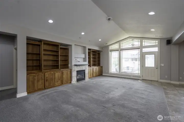 Living room, gas fireplace, and built ins