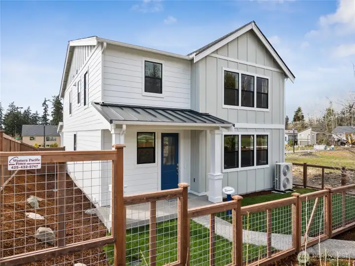 Fully fenced yard with a gate opens to community walking path. Photo is representational. Actual home is under construction and finishes and paint colors may vary. See site agent for details.... Fully fenced yard with a gate opens to community walking path. Photo is representational. Actual home is under construction and finishes and paint colors may vary. See site agent for details....