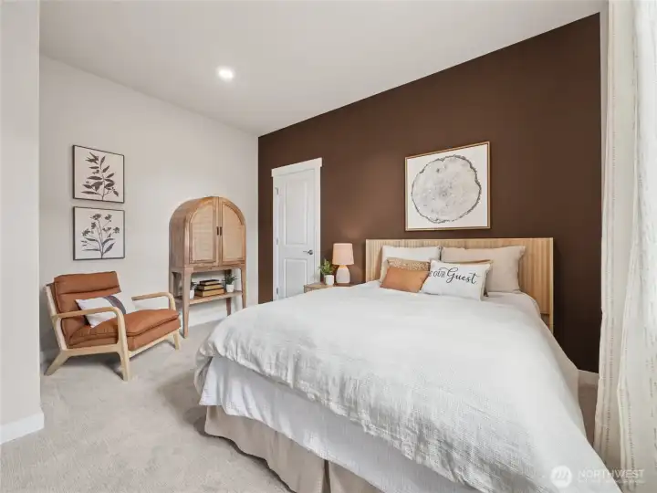 Main level bedroom with huge walk-in closet. Photo is representational. Actual home is under construction and finishes and paint colors may vary. See site agent for details.... Main level bedroom with huge walk-in closet. Photo is representational. Actual home is under construction and finishes and paint colors may vary. See site agent for details....