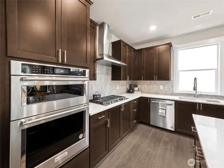 In-wall oven, microwave and separate cooktop. Photo is representational. Actual home is under construction and finishes and paint colors may vary. See site agent for details.... In-wall oven, microwave and separate cooktop. Photo is representational. Actual home is under construction and finishes and paint colors may vary. See site agent for details....