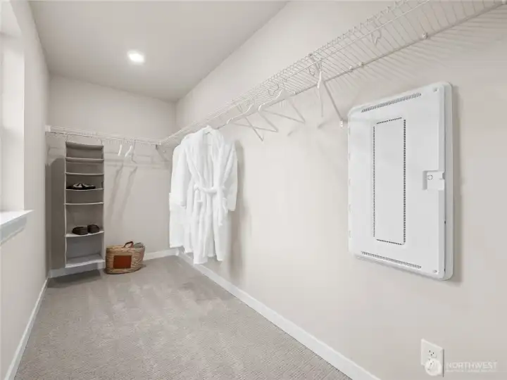 Walk-in closet off primary bedroom with openable window. Photo is representational. Actual home is under construction and finishes and paint colors may vary. See site agent for details.... Walk-in closet off primary bedroom with openable window. Photo is representational. Actual home is under construction and finishes and paint colors may vary. See site agent for details....