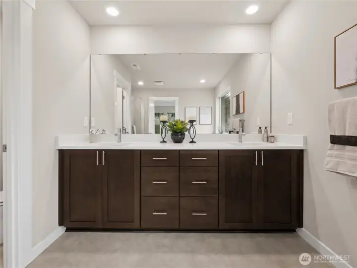 Primary bath with dual sink vanity. Photo is representational. Actual home is under construction and finishes and paint colors may vary. See site agent for details.... Primary bath with dual sink vanity. Photo is representational. Actual home is under construction and finishes and paint colors may vary. See site agent for details....