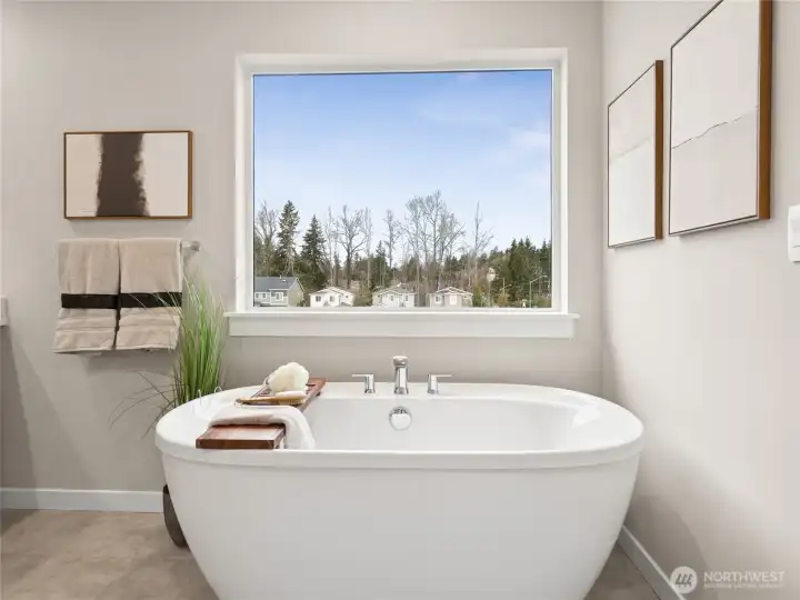 Large soaking tub. Photo is representational. Actual home is under construction and finishes and paint colors may vary. See site agent for details.... Large soaking tub. Photo is representational. Actual home is under construction and finishes and paint colors may vary. See site agent for details....