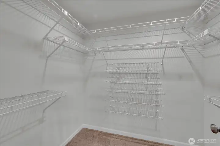 Primary walk-in closet Primary walk-in closet