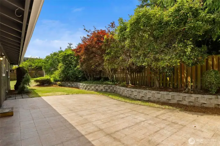 Spacious backyard with large patio perfect for hosting summer BBQs, entertaining or simply unwinding