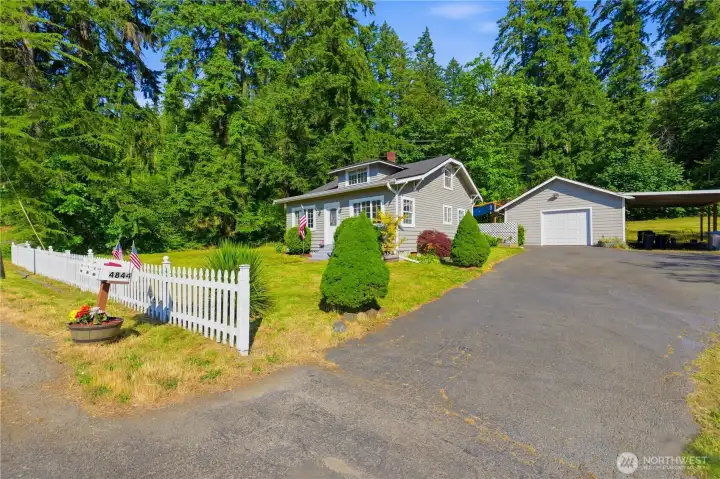 Large driveway to garage and carport Large driveway to garage and carport