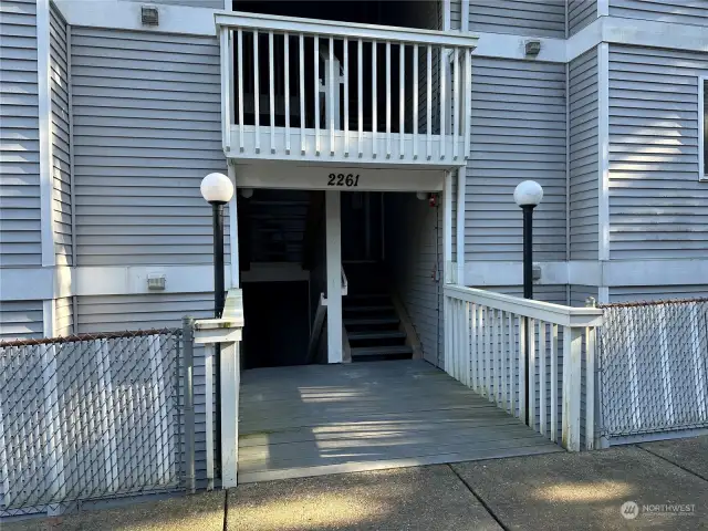Front entrance; unit is down the stairs on the left
