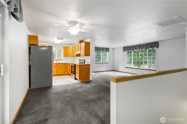 Open, airy feel into kitchen and living areas.