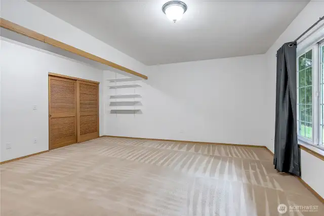 Downstairs primary with full bath or extra family room.