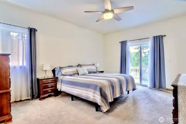 Main floor primary bedroom is perfect for all. Access to the back deck from your is the cherry on top. The huge walk in closet and beautifully updated primary bathroom completes the suite.