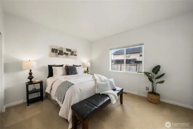 Tucked at the end of the hall if a spacious primary bedroom!