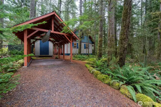 Cabin with outbuilding and covered parking