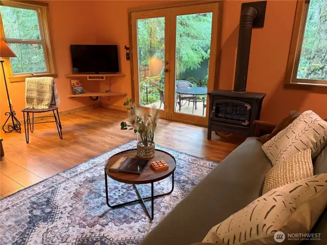 Living room with large doors to private deck