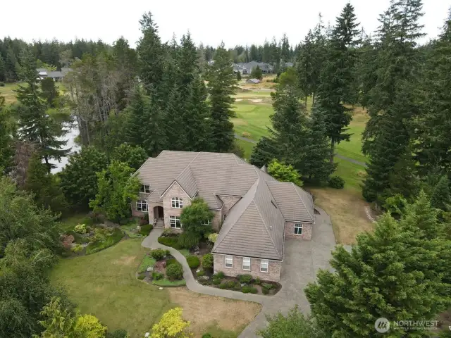 On North Lake's shoreline, and the McCormick Wood's Golf Club's 9th hole, this stunning 6,274 sq. ft. home features Main AND Upper Floor primary suites. 5 bedrooms, 4.5 baths. 3 car garage, indoor swimming pool, Gourmet kitchen, dark cherry hardwoods, Italian porcelain tile, Ledge Stone and granite fireplaces, Office/study, library/den, media room.