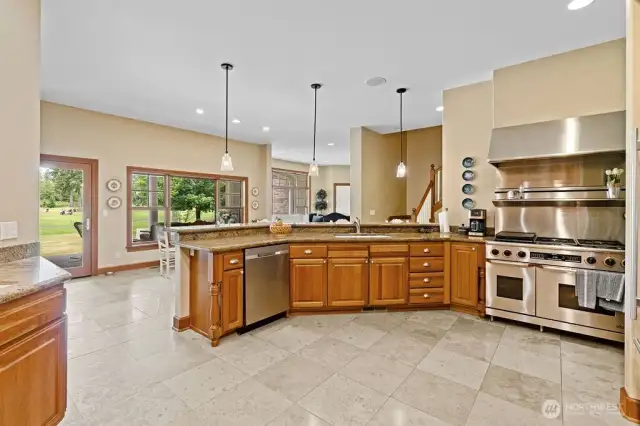 From the kitchen it's a short step to the patio. The upper floor's second stairway can be seen in the center of this photo.