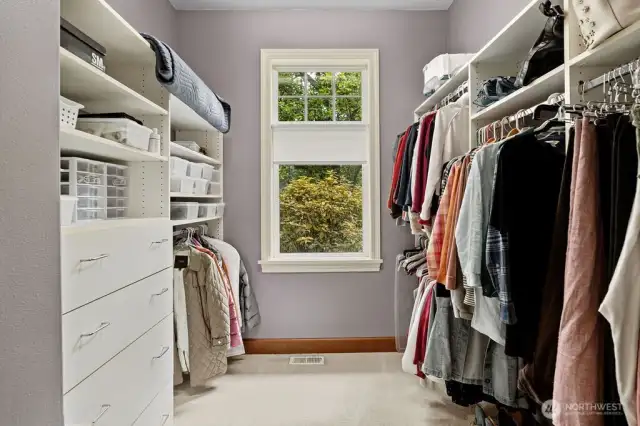 The main level primary bedroom's huge walk in closet.