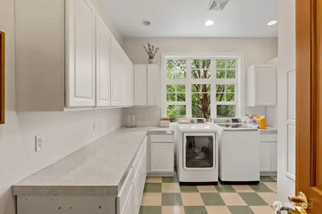 The laundry room with lots of storage.