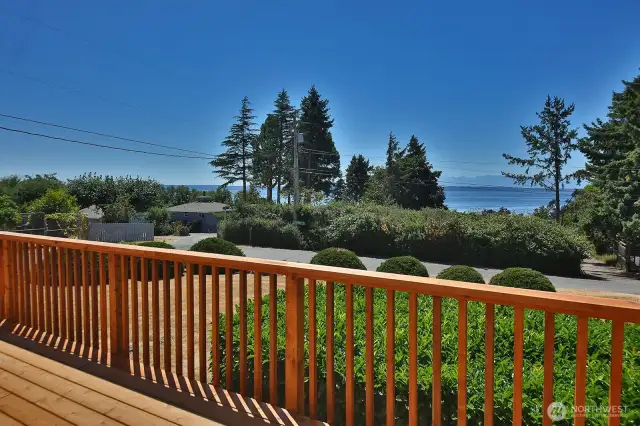 New Deck (2025) along the western front of your beach home! Enjoy sunsets and watching the shipping lanes of Admiralty Inlet.