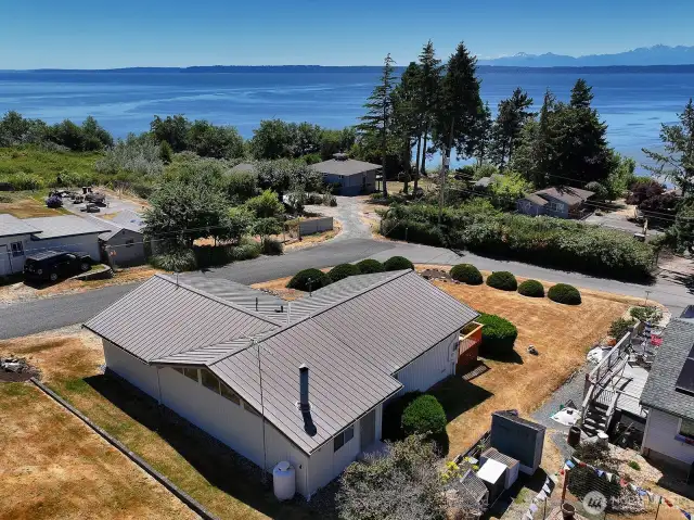 Metal roof and plenty of yard space. Enjoy stunning sunsets and ship action through Admiralty's Inlet.