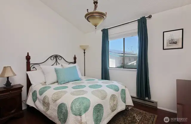 Bedroom with vaulted ceiling.