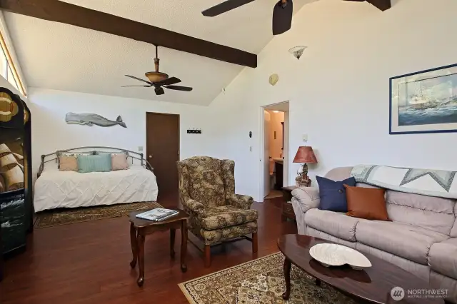 Door to the right of the daybed leads to the garage. Your washer & dryer and 1/2 bath are located in your two car garage. A glimpse of the full bath is seen through the open door in the hallway.