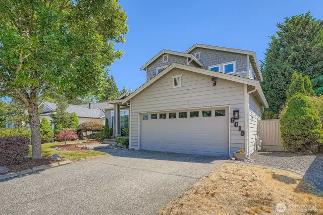 Front of home with 2 car garage and driveway for guests