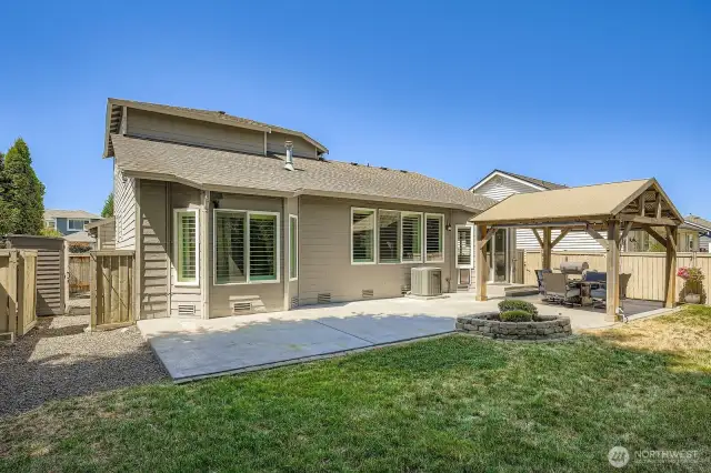 Backyard with side gate and shed to keep your yard tools out of the garage