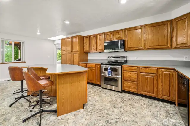 Several of the lower cabinets and pantry include pull out shelving. Brand new microwave.